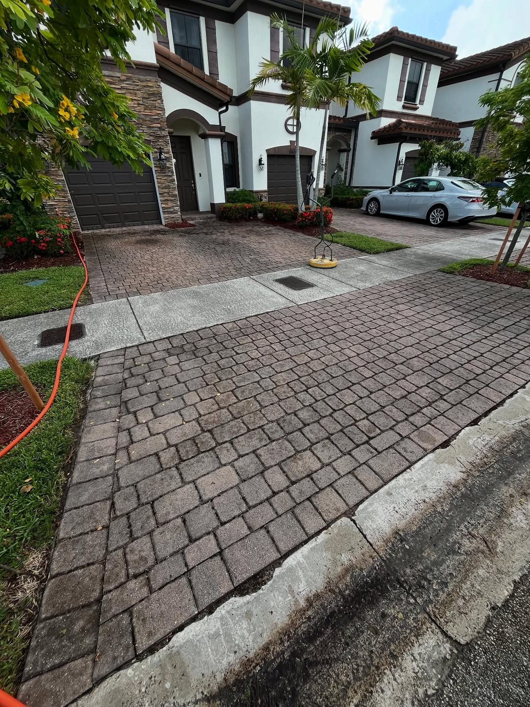 Driveway before pressure washing